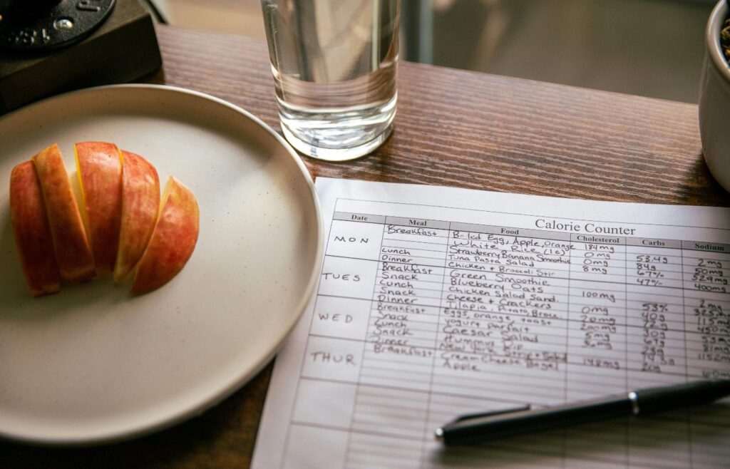 Apple Slices Beside a Calorie Counting Form