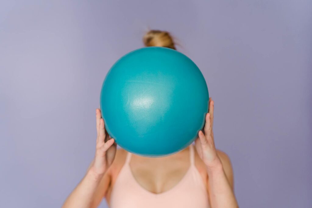 woman with therapy ball